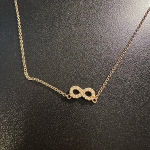 Gold Infinity necklace.